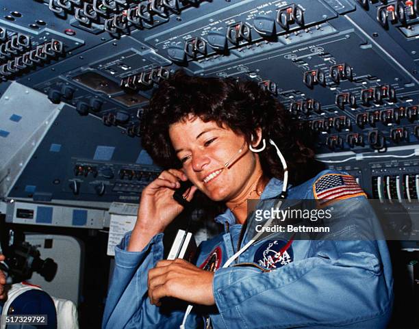 Johnson Space Center, Houston, Texas: On board Scene-Astronaut Sally K. Ride, STS-7 mission specialist, communicates with ground controllers from the...