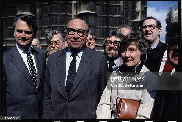 Close-Up of British Member of Parliament Roy Jenkins, standing with a group outside of Parliament.