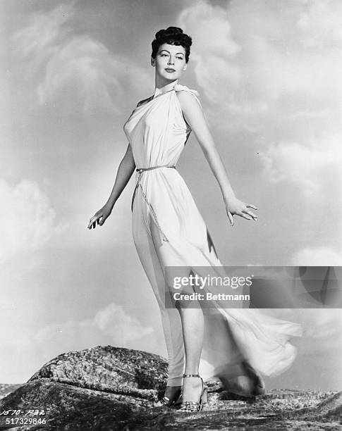 Hollywood, CA- The breeze toys with the classic Grecian costume of a modern Venus as she stands high on a Hollywood hilltop. Luscious Ava Gardner,...