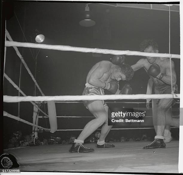 Cyrille Delannoit , European middleweight champion, crumples from the hard right thrown by Marcel Cerdan, the former champ, in the 13th round of...