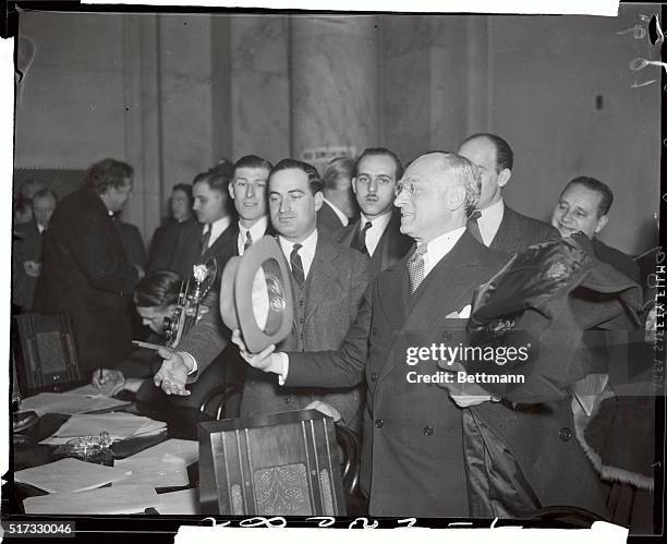 Felix Frankfurter, leaves the morning session of the Senate Judiciary Committee which conducted hearings on his nomination to the Supreme Court.