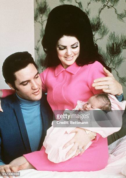Elvis Presley and his wife, Priscilla, prepare to leave the hospital with their new daughter, Lisa Marie. Memphis, Tennessee, February 5, 1968.