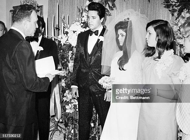 Elvis Presley and his bride, the former Priscilla Ann Beaulieu, are pronounced man and wife by Nevada Supreme Court Justice David Zenoff at the...