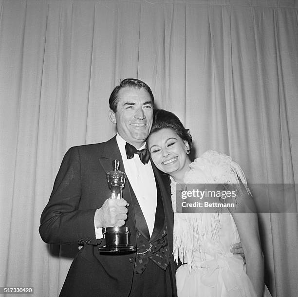 Gregory Peck holds his Academy Award for Best Actor , while Sophia Loren puts her head on this shoulder. Loren had presented the Best Actor Oscar, as...