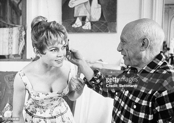 France: Picasso and Brigitte Bardot: The painter studying proportion of Bardot's head. From film made in France in the 1950's.