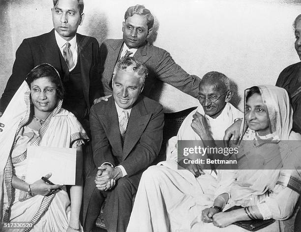 London, England:Charlie Chaplin, Czar of screen comics, pays a friendly call on Mahatma Gandhi, leader of the Indian Nationalists cause, who first...