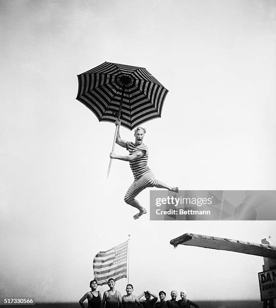 Here's Harold Kruger, who was a member of the Olympic Swimming team in 1924, doing some comic diving stunts at the Olympic Pool in Long Beach, NY.