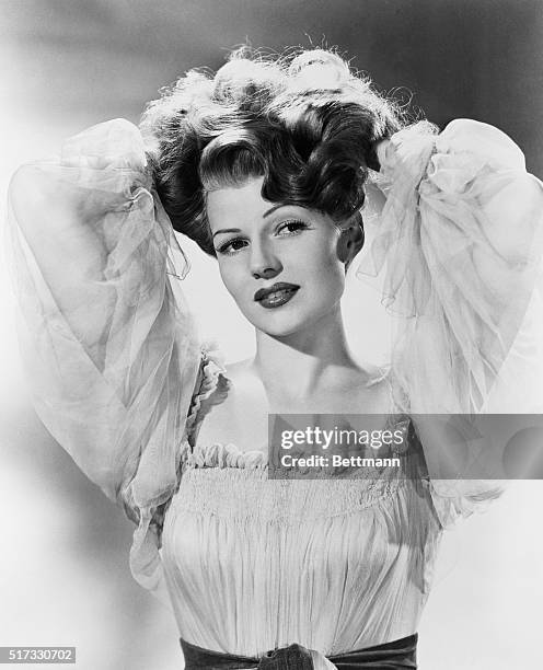 New York: Screen star Rita Hayworth, whose titan tresses have brought her the title of America's number one redhead. The selection was made by the...