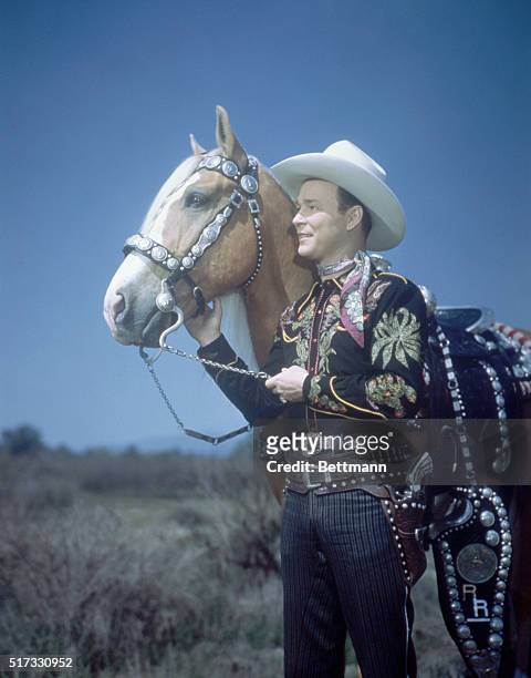 Roy Rogers, American singing cowboy, and his horse Trigger. Undated color slide.