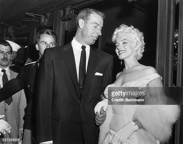Joe DiMaggio escorts ex-wife Marilyn Monroe to the premiere of her movie The Seven Year Itch