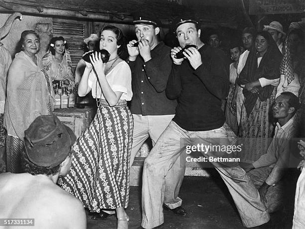 Dorothy Lamour, Bing Crosby and Bob Hope play instruments in a publicity still from Paramount's 1940 film "Road to Singapore." Copyright 1940...