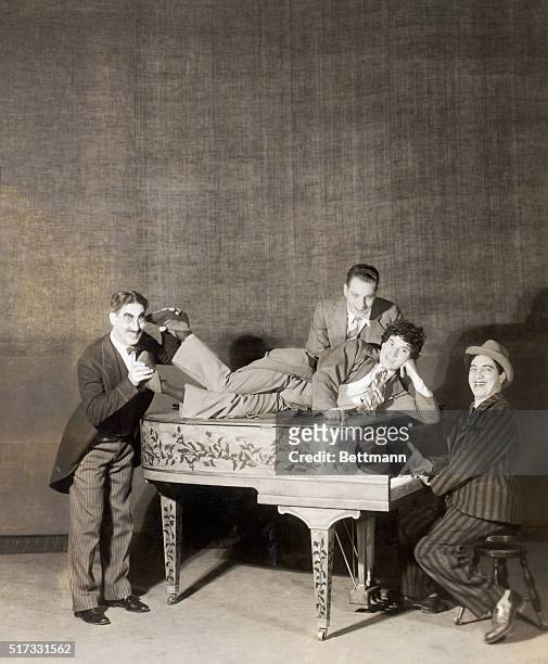 Groucho, Harpo, Chico and Zeppo at the piano in a scene from "The Cocoanuts."