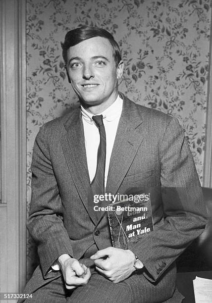 William F. Buckley, writer, with first book, "God and man at Yale." photo, 1951.