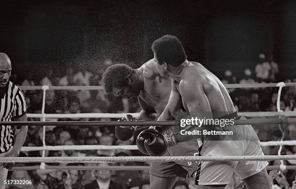 Kinshasa, Zaire: Muhammad Ali smashes a right to the head of George Foreman.