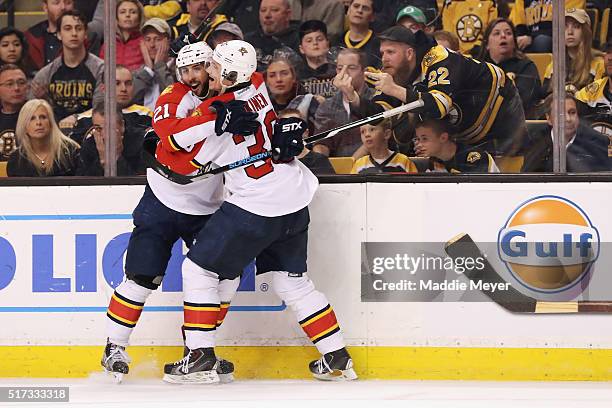 Vincent Trocheck of the Florida Panthers celebrates with Teddy Purcell while being taunted by a Bruins fan after scoring against the Boston Bruins...