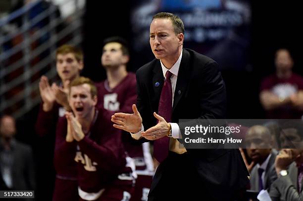 Head coach Billy Kennedy of the Texas A&M Aggies cheers on his team in the second half while taking on the Oklahoma Sooners in the 2016 NCAA Men's...