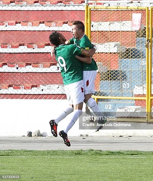 Alejandro Chumacero of Bolivia celebrates with teammate Yasmani Duk after scoring the second goal of his team during a match between Bolivia and...