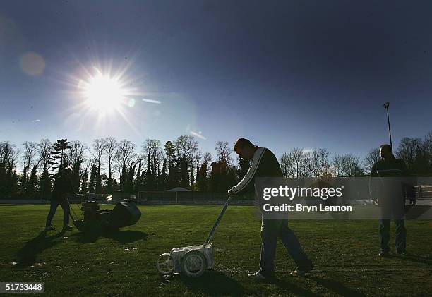 The Histon FC groundstaff prepare the pitch for the FA Cup match between Histon FC and Shrewsbury Town at The Bridge on November 12, 2004 in...