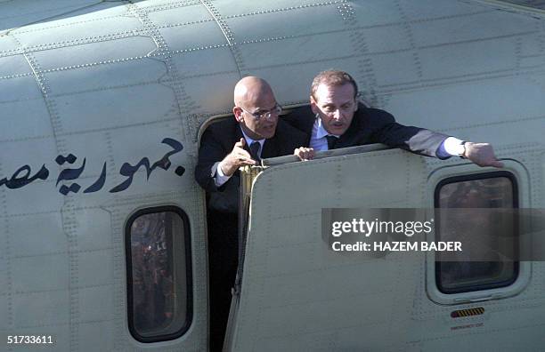 Official Yasser Abed Rabbo and negotiations minister Saeb Erakat plead with the crowd to make room for the coffin of late Palestinian leader Yasser...