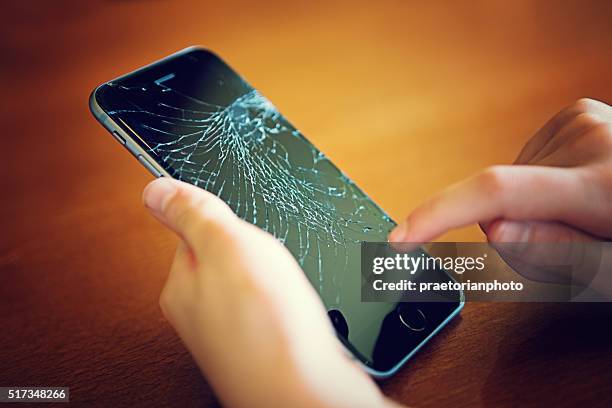 broken iphone 6 - repairing iphone stock pictures, royalty-free photos & images