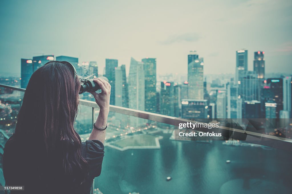 Woman Enjoying the City View on Rooftop Deck