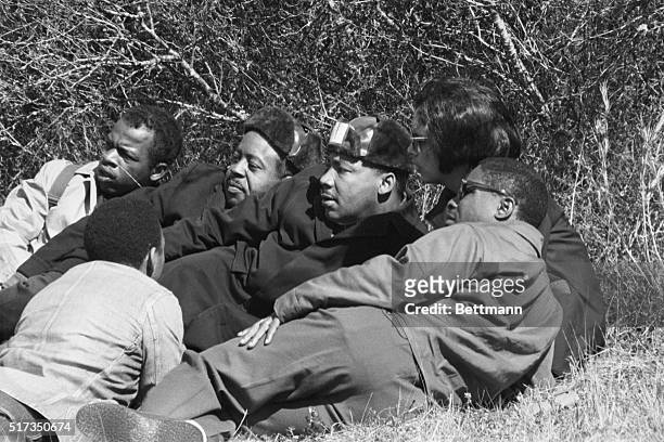 Selma, AL: A young Negro kneels in front of the Selma-to-Montgomery march leaders, during a roadside break. From right are Revrend Dr. Martin Luther...