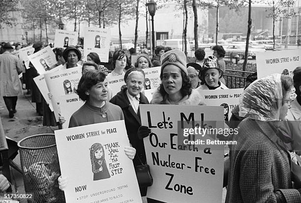 Coretta Scott King , wife of civil rights leader Martin Luther King Jr., joins Women Strike for Peace founder Dagmar Wilson in a march on the United...