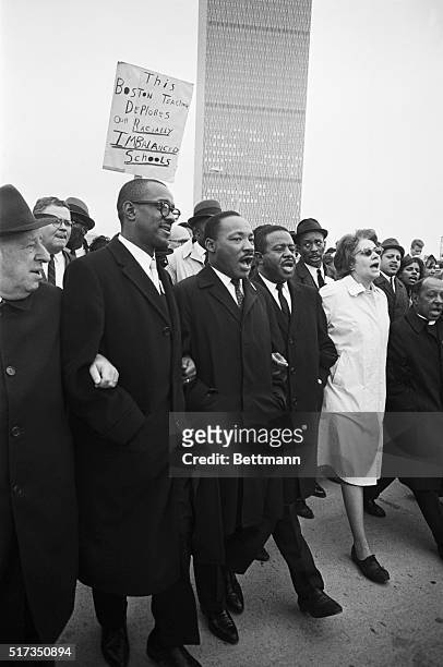 Boston, MA: With Boston's newest skyscraper in the background, Dr. Martin Luther King leads marchers from Roxbury to the Common, where he will...