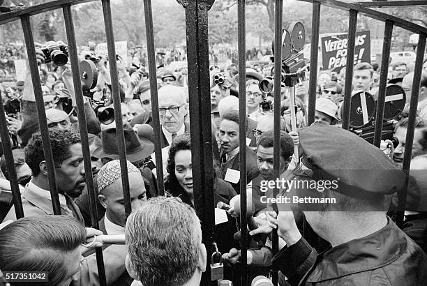 Washington, D.C.: Demonstrators representing the "Mobilization to End the War in Vietnam," jam to the barred main gate of the White House today. The...