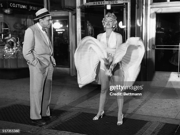 Tom Ewell and Marilyn Monroe in a scene from the movie The Seven Year Itch.