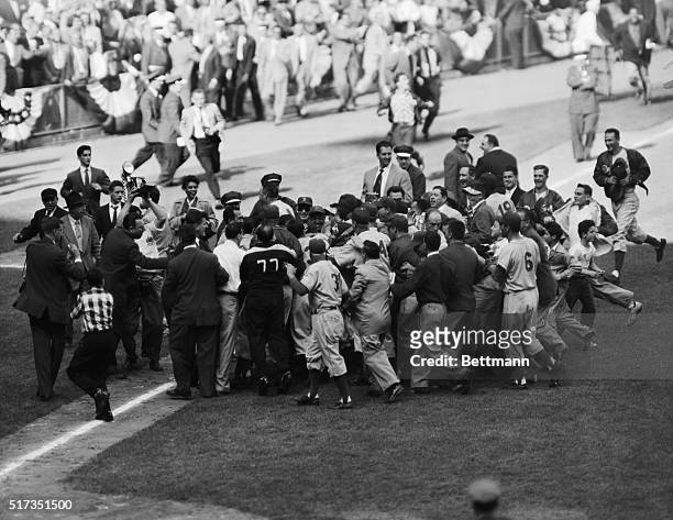 New York, NY: ...AND THEN THERE WAS PANDEMONIUM. Johnny Podres, 23-year-old lefthander who won his second and the Dodgers' final World Series victory...