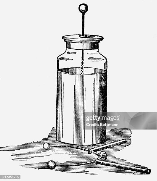 The Leyden Jar and discharger used by Musschenborck in his experiments to collect electric fluid in a bottle half filled with water. Undated...