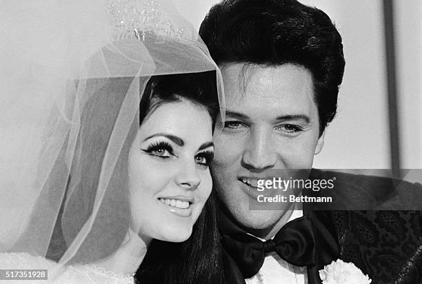 Las Vegas, NV- Singer Elvis Presley and his bride Priscilla Ann Beaulieu, pose for photograph following their wedding at the Aladdin Hotel. Presley...