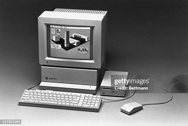 Apple IIGS personal computer with an AppleColor RGB monitor and an 800 kilobyte 3.5 disk drive.