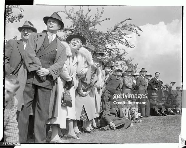 Spectators watch the flight of the ball during a driving contest on September 16th, which served as a curtain-raiser for the Western Open Golf...
