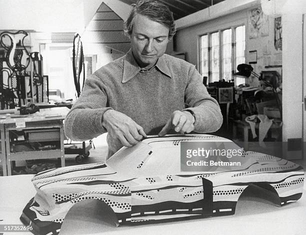 Southampton, NY- Artist Roy Lichtenstein paints a model of the racing version of BMW's street model 320i in his Southampton studio recently. His pop...