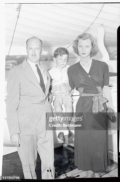 Mr. And Mrs. Drew Pearson are pictured as they arrived here aboard the S.S. De Grasse with Mrs. Pearson's son by a former marriage. Tyler Abel, the...