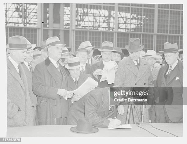 New York: Three Major Airlines Sign For New Airport--Mayor Fiorello H. La Guardia of New York City, is shown the third of the three contracts he...