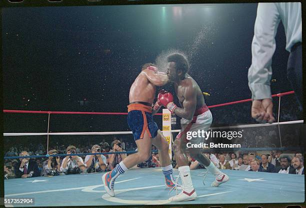 Heavyweight Champion Michael Dokes ducks a punch from challenger Gerrie Coetzee in the 6th round of their title fight September 23.