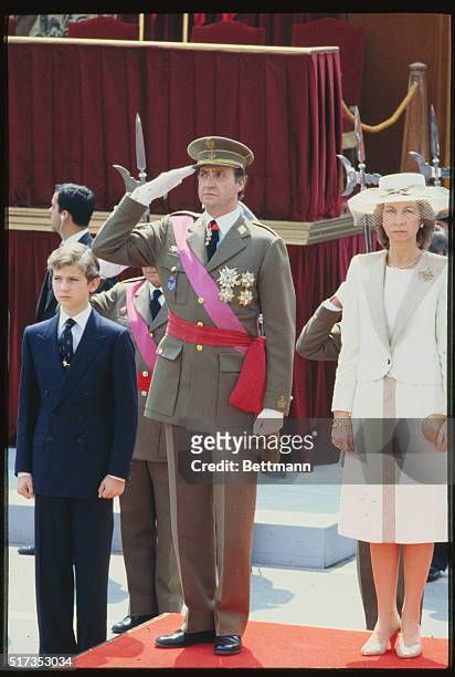 King Juan Carlos of Spain is seen here presiding over the Armed Forces Parade. Cabinet members and Premier Felipe Gonzalez were also on hand for...