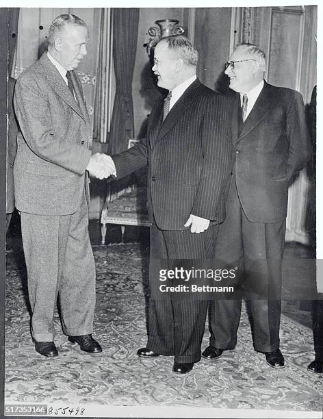 Secretary of State George C. Marshall is greeted by Viacheslav M. Molotov, Soviet Foreign Minister, and his deputy, Andrei Vishinsky , as he arrives...