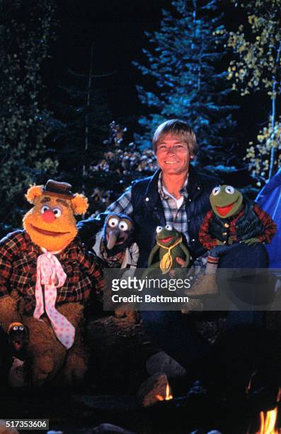 Musician John Denver poses with the Muppets during an episode of the Muppet Show. From left are Fozzie Bear, Gonzo, John Denver and Kermit the Frog.