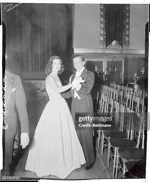 The season's number one debutante, Brenda Frazier, daughter of Mrs. Frederick N. Watriss, is shown dancing with one of her four escorts at the Louis...