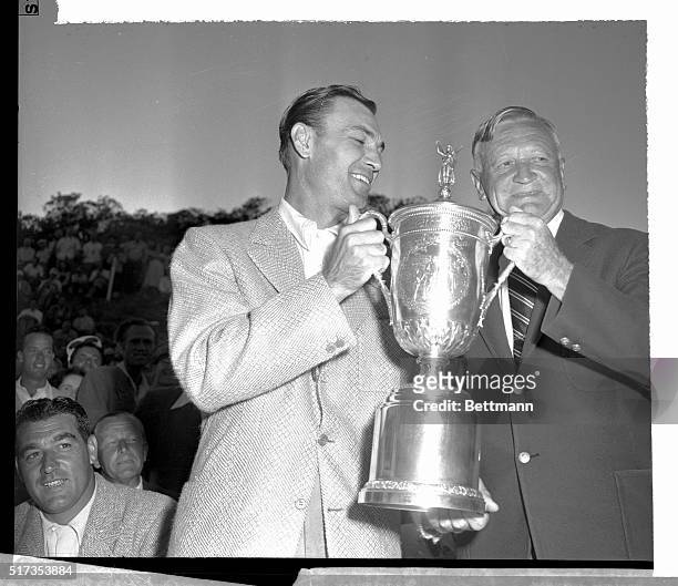 The new United States Open Golf Champion, Ben Hogan of Hershey, Pennsylvania , accepts the silver cup of victory from the president of the USGA,...