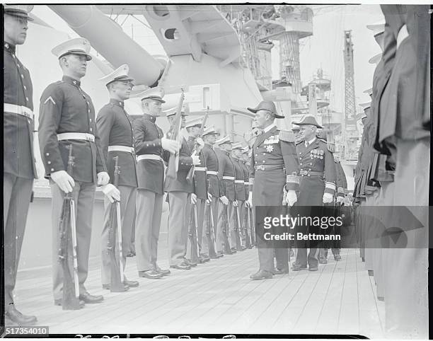 New York: Norse Prince Inspects The Marines. Wearing the uniform of an admiral of the Norwegian Navy, Crown Prince Olav, nearest camera, is pictured...