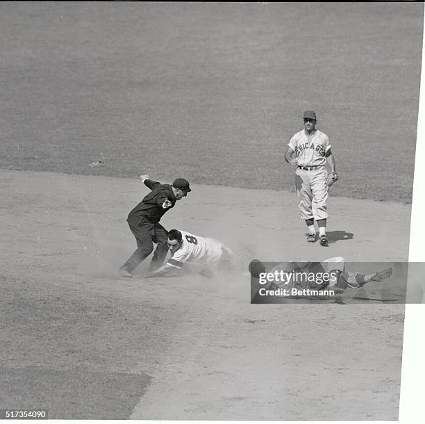 The 100-degree sun was no hotter than the White Sox on this play as they knock off Yogi Berra at second after Bill Johnson struck out. Twin killing...