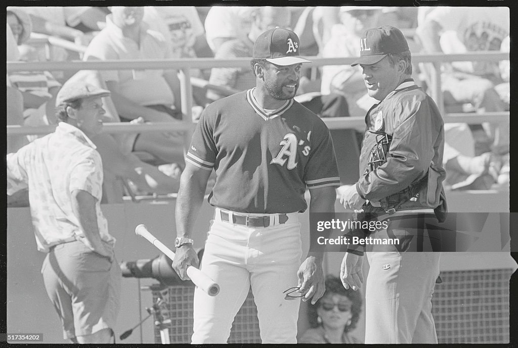 Reggie Jackson Conversing with Larry McCoy