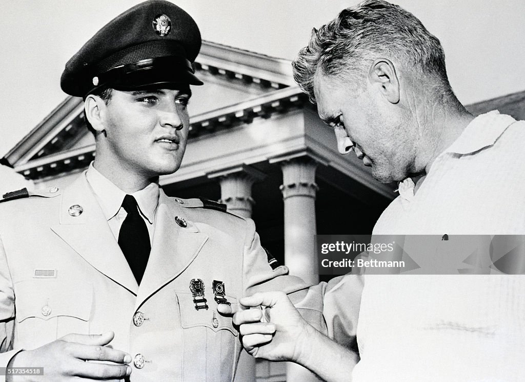 Elvis Presley's Father Admiring Medals