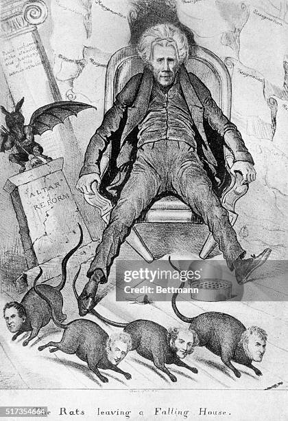 Political cartoon depicts President Andrew Jackson sitting stunned as his cabinet, represented as rats, run to escape his falling house. The cartoon...
