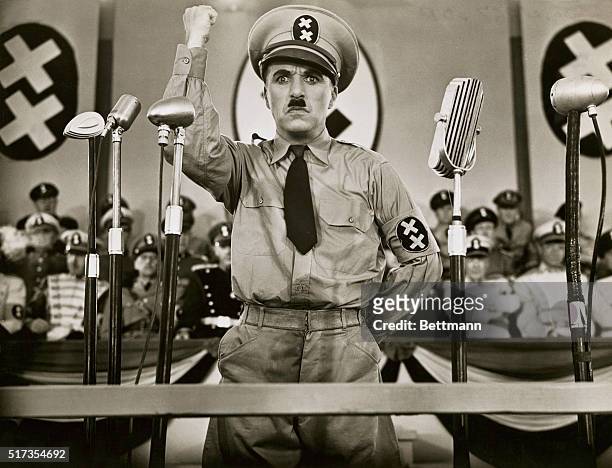 Actor and director Charlie Chaplin plays dictator Adenoid Hynkel in The Great Dictator, a satire on Nazi Germany.